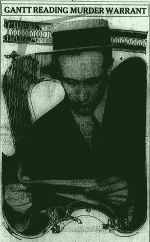 Gantt reading murder warrant [John M. Gantt was a family friend of Mary Phagan's and was accused of being "infatuated" with the young girl. He was let into the factory on Saturday to retrieve pairs of shoes he had left there prior to his leaving the company. Newt Lee accompanied him as he retrieved his shoes and left Saturday afternoon -- Ed.]